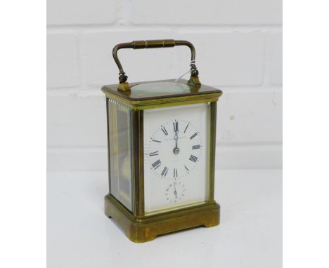 A Hamilton & Inches brass cased carriage clock, the enameled dial with Roman numerals and subsidiaries dial, height including