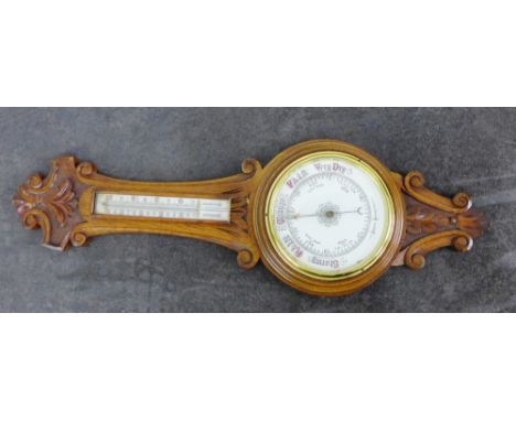 A carved oak wall barometer, 90cm
