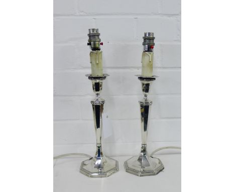 A pair of matched  George V silver candlesticks, converted to table lamp bases, bearing makers marks for George Howson, Sheff