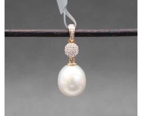 Gemporia - An 18ct gold cultured pearl and diamond pendant, set with oval South Sea cultured pearl and round cut diamonds, to