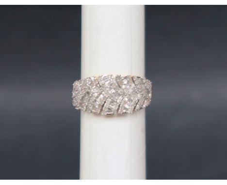 Gemporia - A 9ct gold Tomas Rae diamond ring, set with round and tapered baguette cut diamonds, to a 9ct gold setting and sha