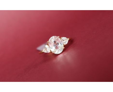 Gemporia - A 9ct gold zircon ring, set with oval and triangle zircons, to a 9ct gold setting and shank, size L to M