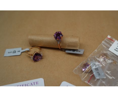 Gemporia - A 9ct gold amethyst and white zircon ring, set with 4.3ct fancy cut amethyst, to a 9ct gold setting and shank, siz