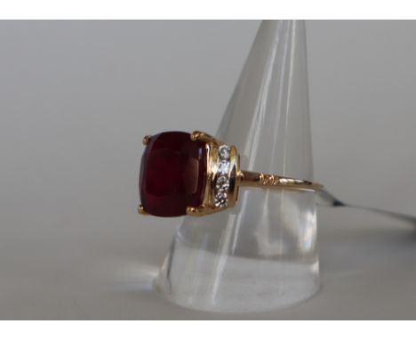 Gemporia - A 9ct gold ruby and white zircon ring, set with cushion cut Malagasy ruby and round cut white zircons, to a 9ct go