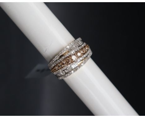 Gemporia - A 9ct gold diamond ring, set with round and tapered baguette cut diamonds totalling 1.5ct, to a 9ct gold setting a