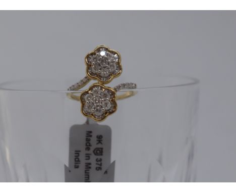 Gemporia - A 9ct gold Tomas Rae diamond ring, set with tapered baguette and round cut diamonds totalling 1ct, to a 9ct gold s