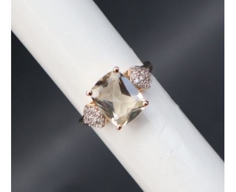 Gemporia - A 9ct gold serenite and white zircon ring, set with  cushion cut serenite and round cut white zircons, to a 9ct go