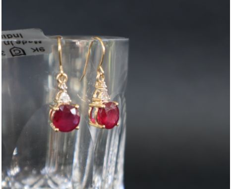 Gemporia - A pair of 9ct gold ruby and white zircon earrings, set with round cut Malagasy rubies and triangle and round cut w