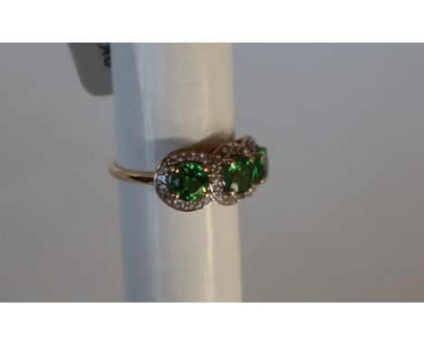 Gemporia - A 9ct gold Tsavorite Garnet and white zircon ring, set with round garnets and white zircons, to a 9ct gold setting