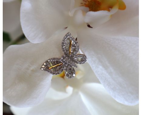 Gemporia - A 9ct gold Tomas Rae butterfly design diamond ring, set with round and tapered baguette cut diamond totalling 1.14