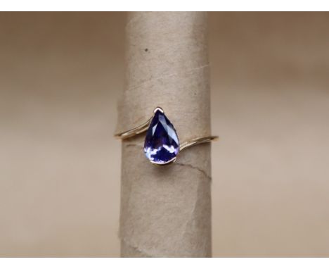 Gemporia - A 9ct gold tanzanite ring, set with pear shaped tanzanite to a 9ct gold setting, size L to M