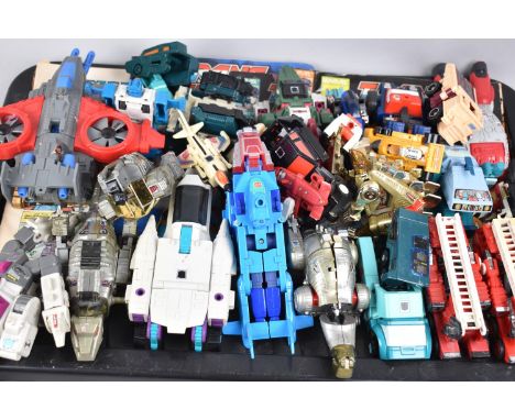 A Collection of Various Vintage Transformer Toys and Magazines 