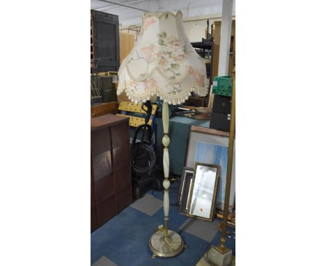 A Brass and Onyx Standard Lamp with Shade 