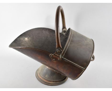 A Vintage Copper Helmet Shaped Coal Scuttle 