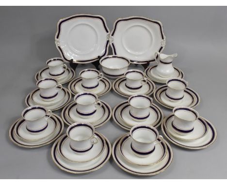 A Tuscan China Cobalt Blue and Geometric Trim Tea Set to comprise Cups, Saucers, Side Plates, Milk Jug, Cake Plate and Sugar 