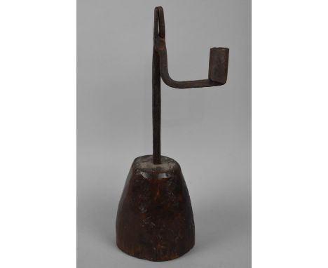 An Early English Iron Rush Light on Turned Wooden Tapering Support, 28cms High 