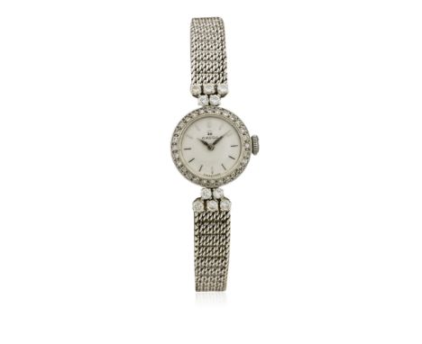 A LADIES 18K SOLID WHITE GOLD &amp; DIAMOND OMEGA BRACELET WATCH CIRCA 1960 D: Silver dial with silver batons &amp; "dagger" 