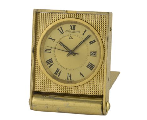 A GILT METAL JAEGER LECOULTRE ALARM TRAVEL CLOCK CIRCA 1970s 
D: Two piece champagne dial with Roman numerals, inner minute t