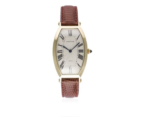 A FINE GENTLEMAN'S 18K SOLID GOLD CARTIER TONNEAU WRIST WATCH CIRCA 1990s 
D: Silver guilloche dial with Roman numerals &amp;