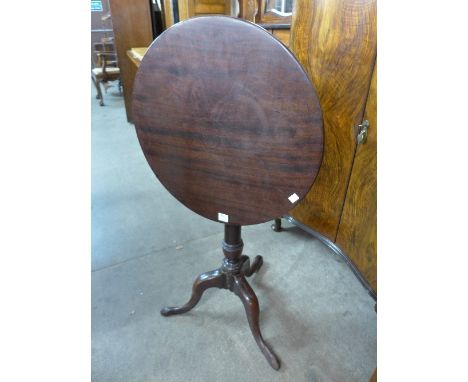 A George III mahogany circular tilt-top tripod table