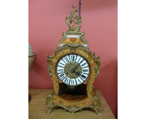 A French style inlaid burr walnut and gilt metal mounted bracket clock