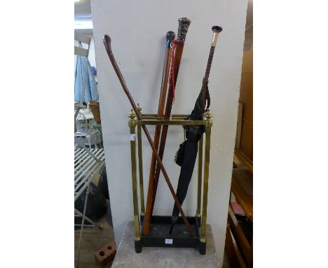 A brass stick stand and sticks