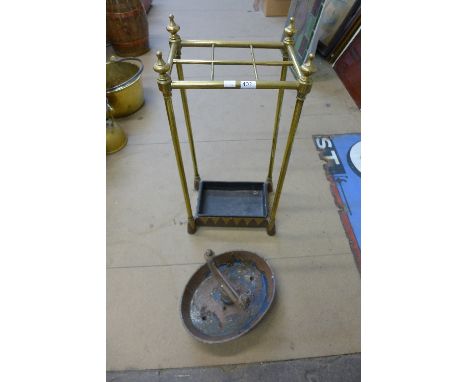 A brass stick stand and boot scraper