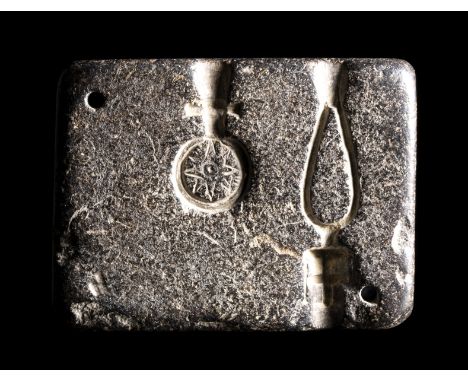AN EASTERN MEDITERRANEAN SANDSTONE JEWELRY MOLDEarly 1st millenium B.C.37x49x9 mm;One half of a jewellery mould carved from a