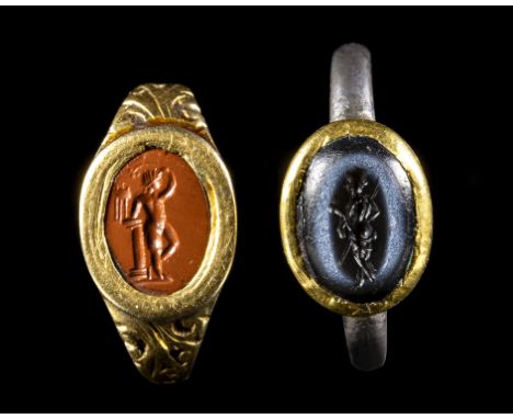 A LOT OF 2 RINGS WITH ROMAN INTAGLIOS. DEITIES. 1st - 2nd century A.D.Stone 7x10 mm; 7x11 mm; Total weight 5,08 grOn the left