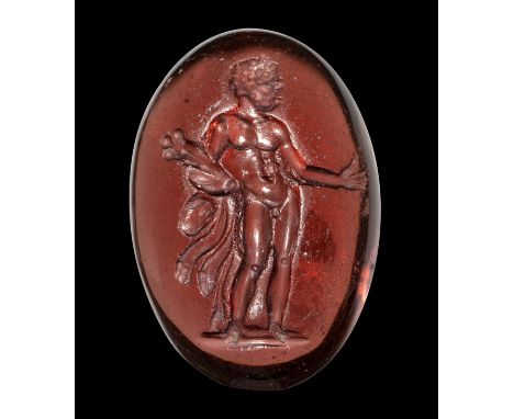 A FINE GREEK GARNET INTAGLIO. STANDING HERCULES. 2nd century B.C.13x19,5x5 mmIn a contrapposto posture, the head facing right