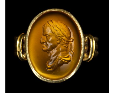 A FINE CARNELIAN INTAGLIO SET IN A GOLD RING. BUST OF GALBA. 18th centuryStone 12x16 mm; int. diam 17,5 mm; 5,83 grThe portra