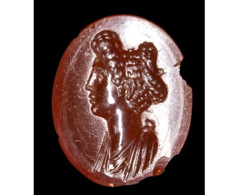 A ROMAN CARNELIAN INTAGLIO. PORTRAIT OF JULIA TITI. 1st century A.D.12x15x3 mmBust portrait of Julia Titi (63-91 A.D.), daugh