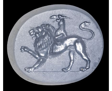 A ROMAN CHALCEDONY INTAGLIO. CHIMERA. 1st century B.C.11x14x3 mmThe hybrid creature is composed of lion body, goat protome on