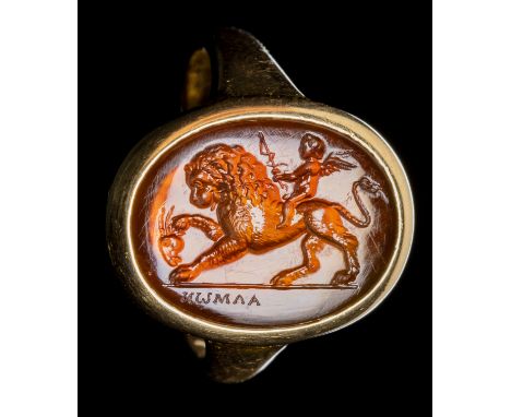 A FINE NEOCLASSICAL SIGNED CARNELIAN INTAGLIO SET IN A GOLD RING. EROS RIDING A LION. 18th-19th centuryStone 12x16 mm; int. d