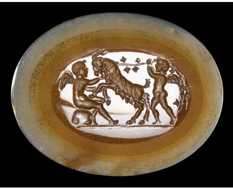 A NEOCLASSICAL AGATE INTAGLIO. TWO EROTES PLAYING WITH A GOAT. 18th century23x31x3 mmOn the left, an Erote tries to tame a go