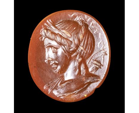 A ROMAN CARNELIAN INTAGLIO. PORTRAIT OF ARTEMIS. 1st century A.D.13x15x3 mmThe goddess is facing left with quiver and bow beh