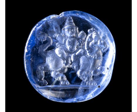 A RARE UNHEATED CEYLON SAPPHIRE INTAGLIO. KRISHNA RIDING A YALI. 18th century or earlierDiam 20x5 mm circaThe scene depicts a