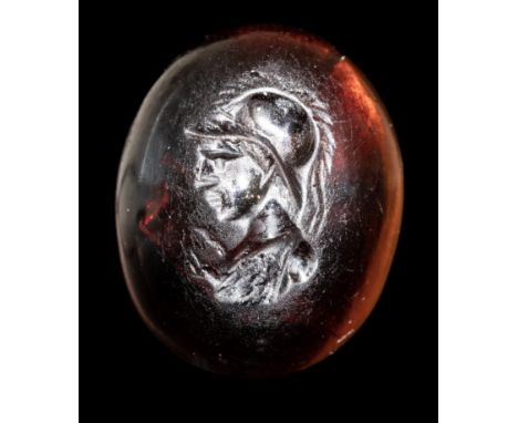 A LATE HELLENISTIC GARNET INTAGLIO. BUST OF ATHENA. 2nd-1st century B.C.9x12x5 mmThe helmeted goddess is facing left. The sur