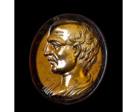 A FINE ROMAN GARNET INTAGLIO. MALE PORTRAIT. Early 1st century A.D.17x19x3 mmPrivate portrait of a Roman character from the l