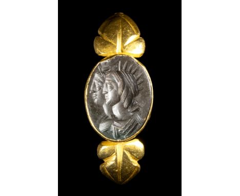 AN EASTERN ROMAN GOLD RING SET WITH A JASPER INTAGLIO. DOUBLE PORTRAIT OF HELIOS AND SELENE. 2nd - 3rd century A.D.Stone 10x1