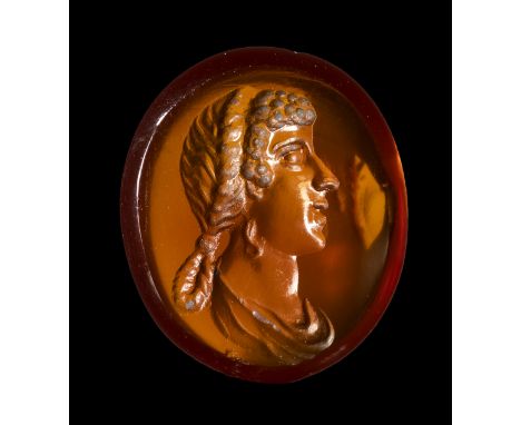 A FINE ROMAN CARNELIAN INTAGLIO. IMPERIAL BUST PORTRAIT OF A MATRONA.1st century A.D.8 x 10 x 2 mmFacing right, her face char