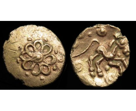 Addedomaros Flower gold quarter stater. Gold, 1.37 g, 13mm. Eight petals around pellet in ring, pellets around. R. Horse righ