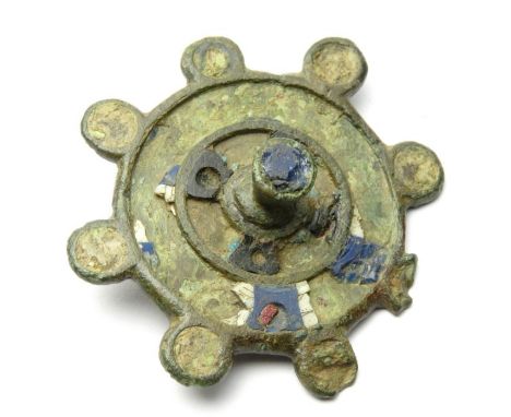 Roman Disc Brooch Circa, 2nd century AD. Copper-alloy, 40mm, 11.4g. Circular brooch with a raised central finial and eight ra