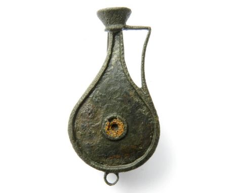 Rare Roman plate brooch in the form of a jug. The jug has a piriform body with a single handle and flared mouth, the body orn
