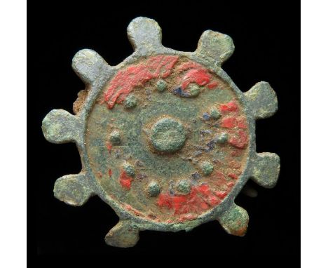 Roman Brooch Circa, 2nd century AD. Copper-alloy, 2.81 g, 33.51 mm. A circular plate brooch with 9 radiating lugs. The face o