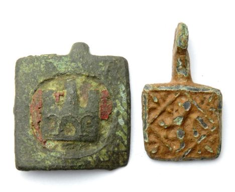 Medieval Pendants  Circa 14th century AD. Two horse harness pendants, one depicting a castle on a field of red enamel and the
