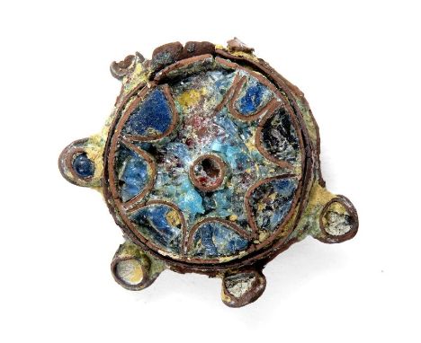 Anglo-Scandinavian cloisonne brooch, circa 11th century. A copper-alloy disc brooch decorated with blue and yellow cloisonne 