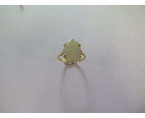 An 18ct yellow gold opal ring size R - approx weight 3.6 grams - head approx 15mm x 11mm 