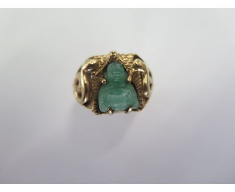 An Oriental yellow gold Jade Buddha ring size R - approx weight 9.5 grams - generally good, surface tests to approx 14ct