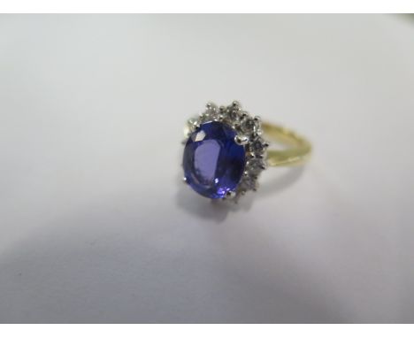 An 18ct yellow gold tanzanite and diamond ring - tanzanite approx 3ct - head size approx 15mm x 13mm - ring size M/N - in goo